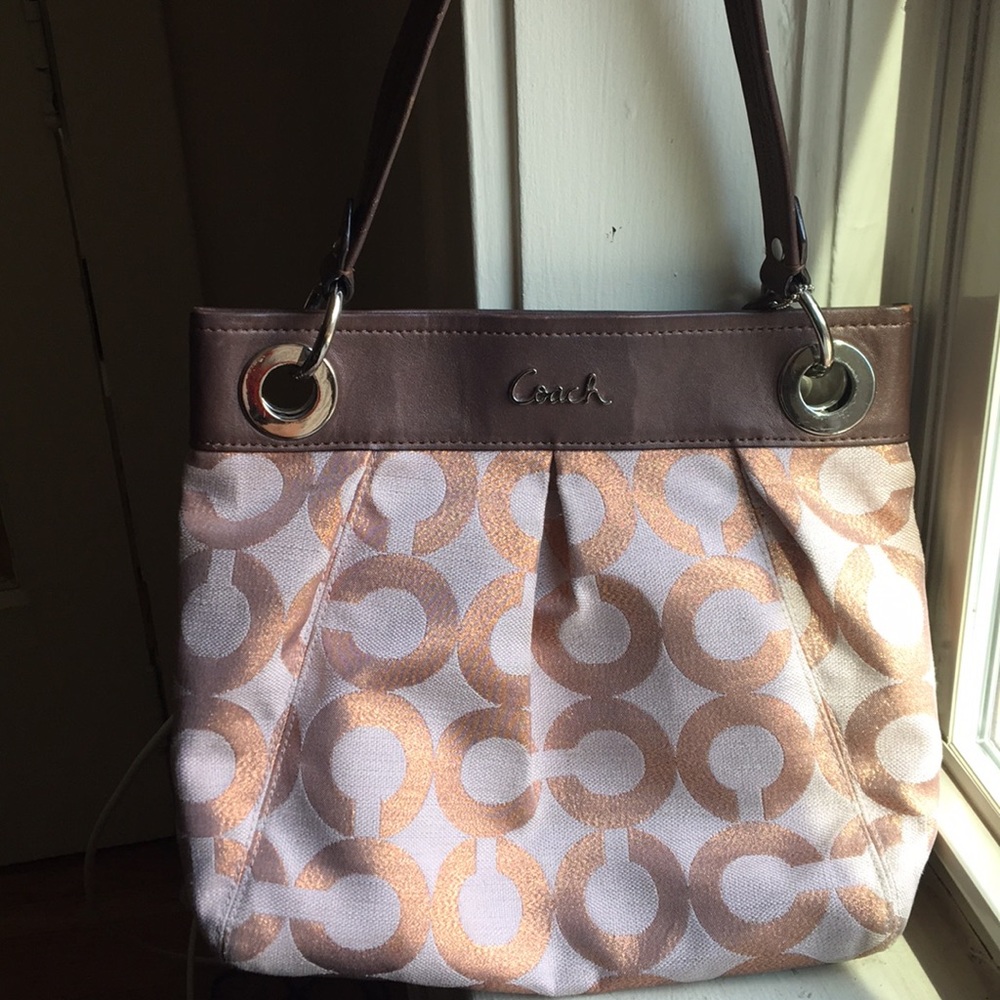 Rose gold and brown coach handbag